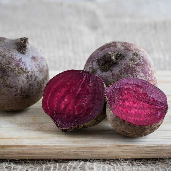 four beetroot bulls blood on a chopping board