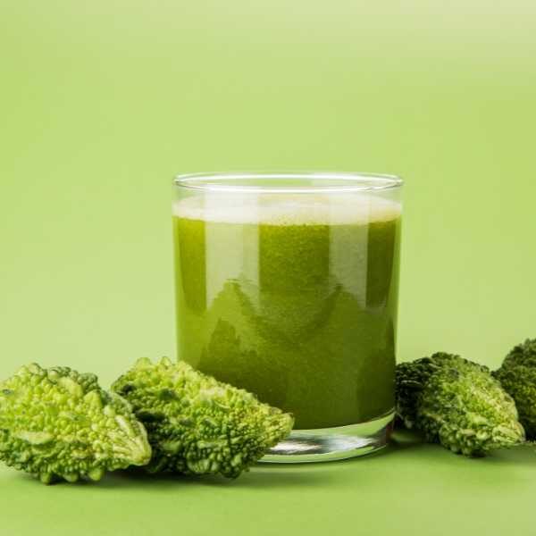 bitter-melon-juice-seeds bitter melon smoothie in a short tumbler