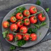 tomato sugar lump tomatoes on a plate on a wooden table