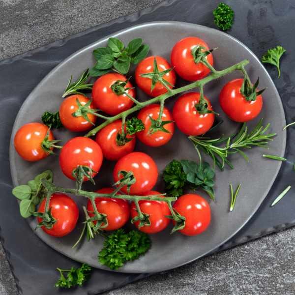 tomato sugar lump tomatoes on a plate on a wooden table