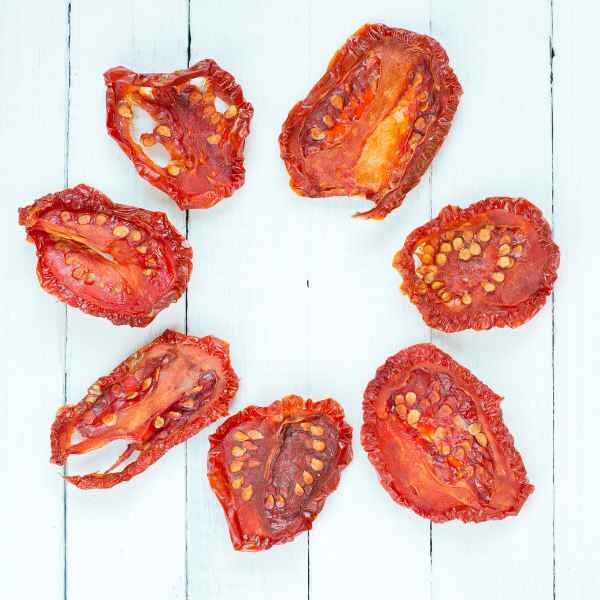 tomato-principe-borghese-seeds-1 sundried Principe Borghese tomatoes on a white wood board