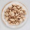 white plate on white paper filled with baob seeds